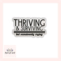 Thriving and Surviving But Occasionally Crying Sticker